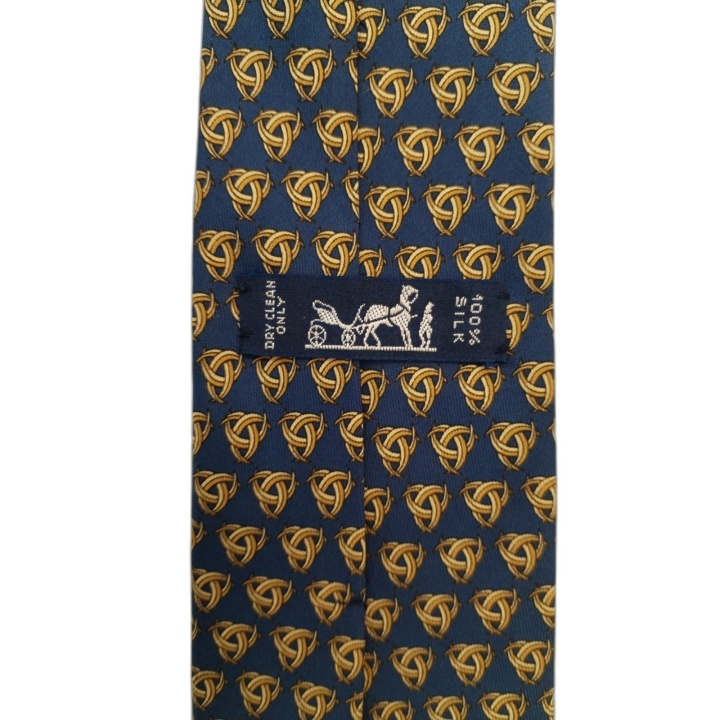Cravate Hermès Paris Soie Bleue Motif Nœuds Dorés - Occasion Excellent