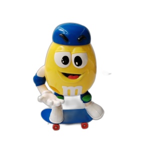 Figurine M&M's Jaune Skateur Distributeur de Bonbons - 18,5 cm - Fonct