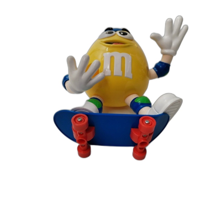 Figurine M&M's Jaune Skateur Distributeur de Bonbons - 18,5 cm - Fonct